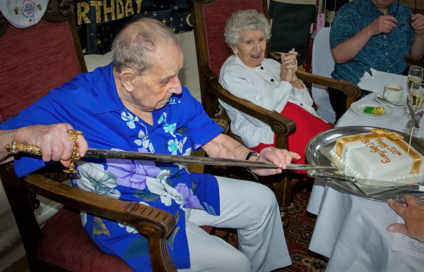 Harry cutting bithday cake